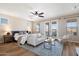 Bright main bedroom features stylish decor, seating area, balcony access, and ceiling fan at 2517 W Balao Dr, Phoenix, AZ 85085