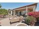 Fire pit and lounge chairs in backyard with covered patio, perfect for entertaining at 29534 N 128Th Ln, Peoria, AZ 85383