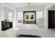 Serene bedroom with neutral tones, built-in storage, and ample natural light, offering a peaceful retreat at 29534 N 128Th Ln, Peoria, AZ 85383