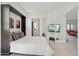 Another bedroom view showcasing built-in storage, natural light, and a television on the wall at 29534 N 128Th Ln, Peoria, AZ 85383