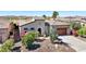Inviting home with desert landscaping, mature plants, and a two car garage at 29534 N 128Th Ln, Peoria, AZ 85383