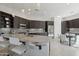 Spacious kitchen featuring a large island with granite countertops and stainless steel appliances at 29534 N 128Th Ln, Peoria, AZ 85383