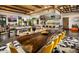Open-concept living space featuring a large dining table, modern kitchen, and stylish decor for seamless entertaining at 29534 N 128Th Ln, Peoria, AZ 85383