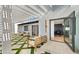 Beautiful backyard featuring a patio with pergola, green turf accents, outdoor furniture, and open doorway at 2629 S Country Club Way, Tempe, AZ 85282