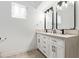 Bathroom with double vanity, stylish mirrors, and modern fixtures at 2629 S Country Club Way, Tempe, AZ 85282
