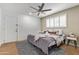 Comfortable bedroom featuring a ceiling fan, natural light, and neutral decor at 2629 S Country Club Way, Tempe, AZ 85282