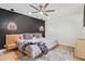 Stylish bedroom with modern décor, a comfortable bed, and trendy light fixtures at 2629 S Country Club Way, Tempe, AZ 85282