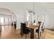 Well-lit dining room with wooden table, seating for six, and views into living spaces at 2629 S Country Club Way, Tempe, AZ 85282
