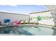 Stylish pool area featuring lounge chairs, decorative elements, and playful inflatables at 2629 S Country Club Way, Tempe, AZ 85282