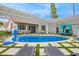 Inviting backyard oasis featuring a sparkling pool, lounge chairs, and covered seating area at 2629 S Country Club Way, Tempe, AZ 85282
