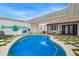 Lush backyard with a private pool, covered patio, and a Scottsdale sign at 2629 S Country Club Way, Tempe, AZ 85282
