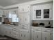 Well-lit kitchen featuring white cabinetry, stylish fixtures, and a functional layout for an enjoyable cooking experience at 2650 W Union Hills Dr # 272, Phoenix, AZ 85027
