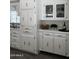 Well-lit kitchen featuring white cabinetry, stylish fixtures, and a functional layout for an enjoyable cooking experience at 2650 W Union Hills Dr # 272, Phoenix, AZ 85027