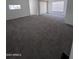 Bright living room featuring carpeted floors and a large window with ample sunlight at 2650 W Union Hills Dr # 272, Phoenix, AZ 85027