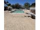 Outdoor pool area with clear blue water, surrounded by lounge chairs and lush landscaping on a sunny day at 2650 W Union Hills Dr # 272, Phoenix, AZ 85027
