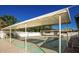 Outdoor shuffleboard court with overhead shade structure and seating at 2650 W Union Hills Dr # 272, Phoenix, AZ 85027
