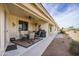 Relax on this covered patio with ceiling fan, outdoor seating, and golf course views at 2662 S Springwood Blvd # 341, Mesa, AZ 85209