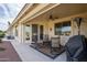 Relax on this covered patio with ceiling fan, outdoor seating, and golf course views at 2662 S Springwood Blvd # 341, Mesa, AZ 85209