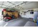 Spacious garage with epoxy flooring, golf cart, and ample storage at 2662 S Springwood Blvd # 341, Mesa, AZ 85209
