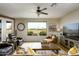 Bright living room with a large window overlooking the golf course, comfortable seating, and stylish decor at 2662 S Springwood Blvd # 341, Mesa, AZ 85209