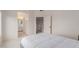 The bedroom features a comfortable bed, a closet, and leads to the en suite bath at 3234 E Marco Polo Rd, Phoenix, AZ 85050