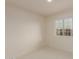 Bright bedroom with light carpet, white walls, and a large window offering neighborhood views at 3234 E Marco Polo Rd, Phoenix, AZ 85050