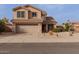 Inviting two-story home featuring a well-manicured front yard and a two-car garage at 3234 E Marco Polo Rd, Phoenix, AZ 85050