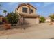 Exterior view of a home with desert landscaping, a two-car garage, and neutral stucco at 3234 E Marco Polo Rd, Phoenix, AZ 85050