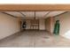 Spacious three-car garage with built-in storage and ample room for vehicles and projects at 3234 E Marco Polo Rd, Phoenix, AZ 85050