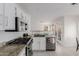 Bright kitchen has stainless steel appliances, white cabinets, and granite counters at 3234 E Marco Polo Rd, Phoenix, AZ 85050