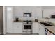 Bright kitchen features stainless steel appliances, granite counters, and white cabinets at 3234 E Marco Polo Rd, Phoenix, AZ 85050