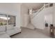 Bright living room with soaring ceilings, and a staircase at 3234 E Marco Polo Rd, Phoenix, AZ 85050