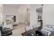 Open-concept living space with white walls, stairs, and a view into the kitchen at 3234 E Marco Polo Rd, Phoenix, AZ 85050