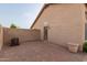 Rear brick patio area showing neutral color stucco exterior and privacy wall at 3234 E Marco Polo Rd, Phoenix, AZ 85050