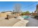 Private backyard featuring a sparkling pool and a relaxing spa, perfect for outdoor entertaining at 328 W Dragon Tree Ave, San Tan Valley, AZ 85140