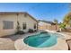 Private backyard featuring a sparkling pool and string lights at 328 W Dragon Tree Ave, San Tan Valley, AZ 85140