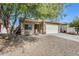 Charming single-story home featuring a well-manicured front yard and an attached two-car garage at 328 W Dragon Tree Ave, San Tan Valley, AZ 85140