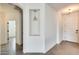 Hallway featuring tile flooring, a decorative niche, and neutral paint at 328 W Dragon Tree Ave, San Tan Valley, AZ 85140