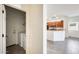 Interior view showcasing the laundry room and a glimpse of the kitchen with wood cabinets at 328 W Dragon Tree Ave, San Tan Valley, AZ 85140