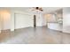 Large living room with tile floors, arches, and an open floor plan to the kitchen at 328 W Dragon Tree Ave, San Tan Valley, AZ 85140