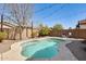 Inviting backyard pool with custom landscaping and string lights for relaxed outdoor living at 328 W Dragon Tree Ave, San Tan Valley, AZ 85140