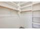 Bright, walk-in closet with ample shelving, providing organized storage solutions at 328 W Dragon Tree Ave, San Tan Valley, AZ 85140