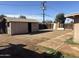 Backyard features gravel landscaping, wooden fence, and storage shed at 3307 W Ocotillo Rd, Phoenix, AZ 85017