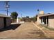 Backyard features gravel landscaping, wooden fence, and storage sheds at 3307 W Ocotillo Rd, Phoenix, AZ 85017