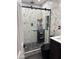 Beautiful bathroom with a glass door shower, rainfall shower head, and stone flooring at 3307 W Ocotillo Rd, Phoenix, AZ 85017