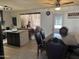 Traditional dining room boasts tiled floors, modern lighting, and dark wood table at 3307 W Ocotillo Rd, Phoenix, AZ 85017