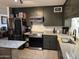 Well-equipped kitchen with stainless steel appliances and modern lighting at 3307 W Ocotillo Rd, Phoenix, AZ 85017