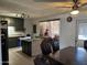 Bright, airy kitchen with granite countertops, stainless steel refrigerator and kitchen island at 3307 W Ocotillo Rd, Phoenix, AZ 85017