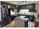 Well-lit kitchen featuring granite countertops, stainless steel appliances, and ample cabinet space at 3307 W Ocotillo Rd, Phoenix, AZ 85017
