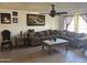 Comfortable living room featuring a large sectional sofa and decorative artwork on the walls at 3307 W Ocotillo Rd, Phoenix, AZ 85017